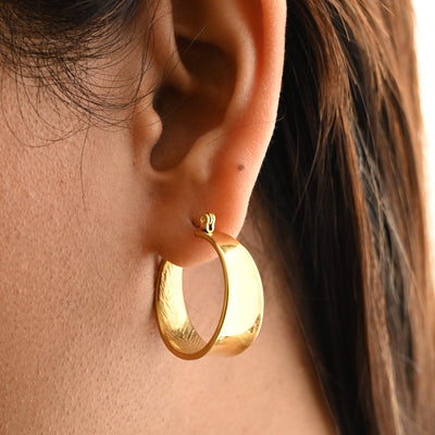 Wide gold hoop earrings