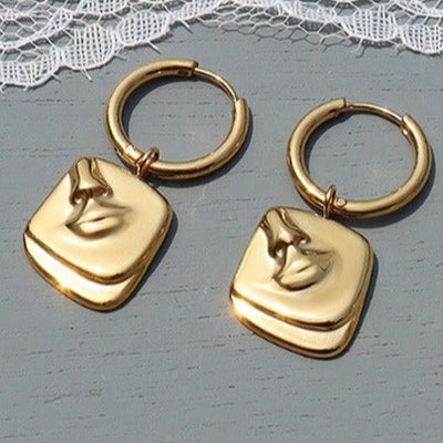 Gold Female Face and body Earrings 