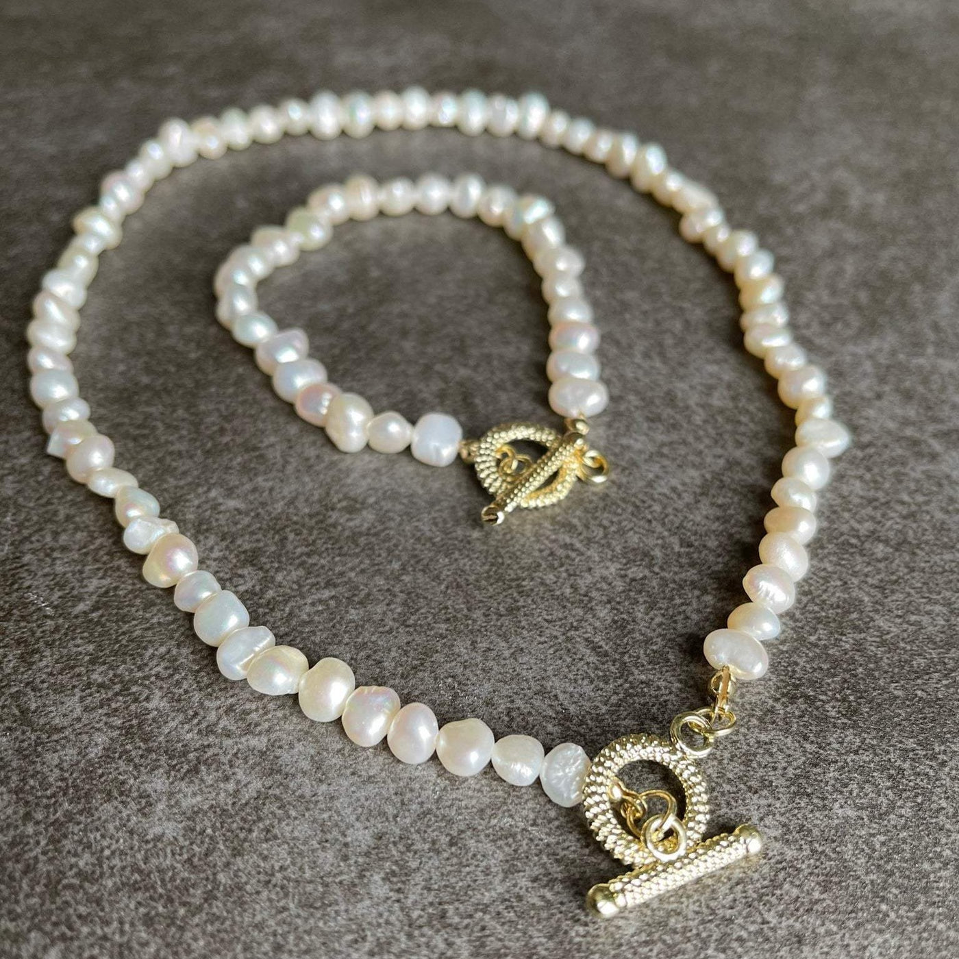 Shop This OT Pearl choker.